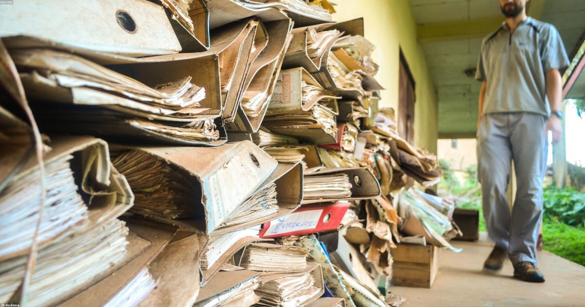Stacked folders and business documents to organize