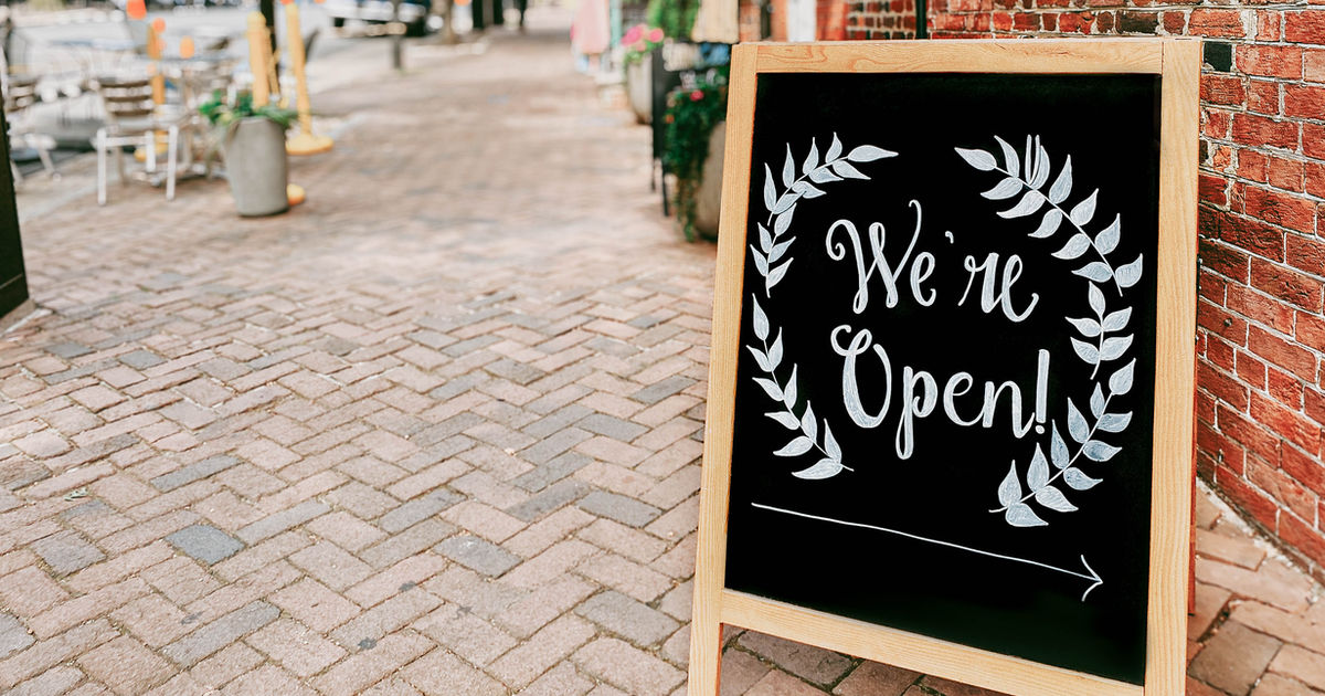 We're Open chalkboard sign for new business launch